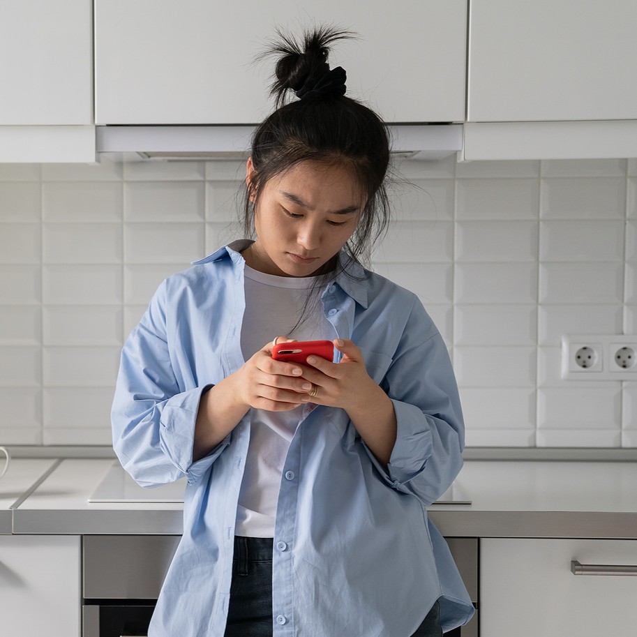 HIV Symptoms and Effects A woman researching on her phone "Chlamydia symptoms and effects."