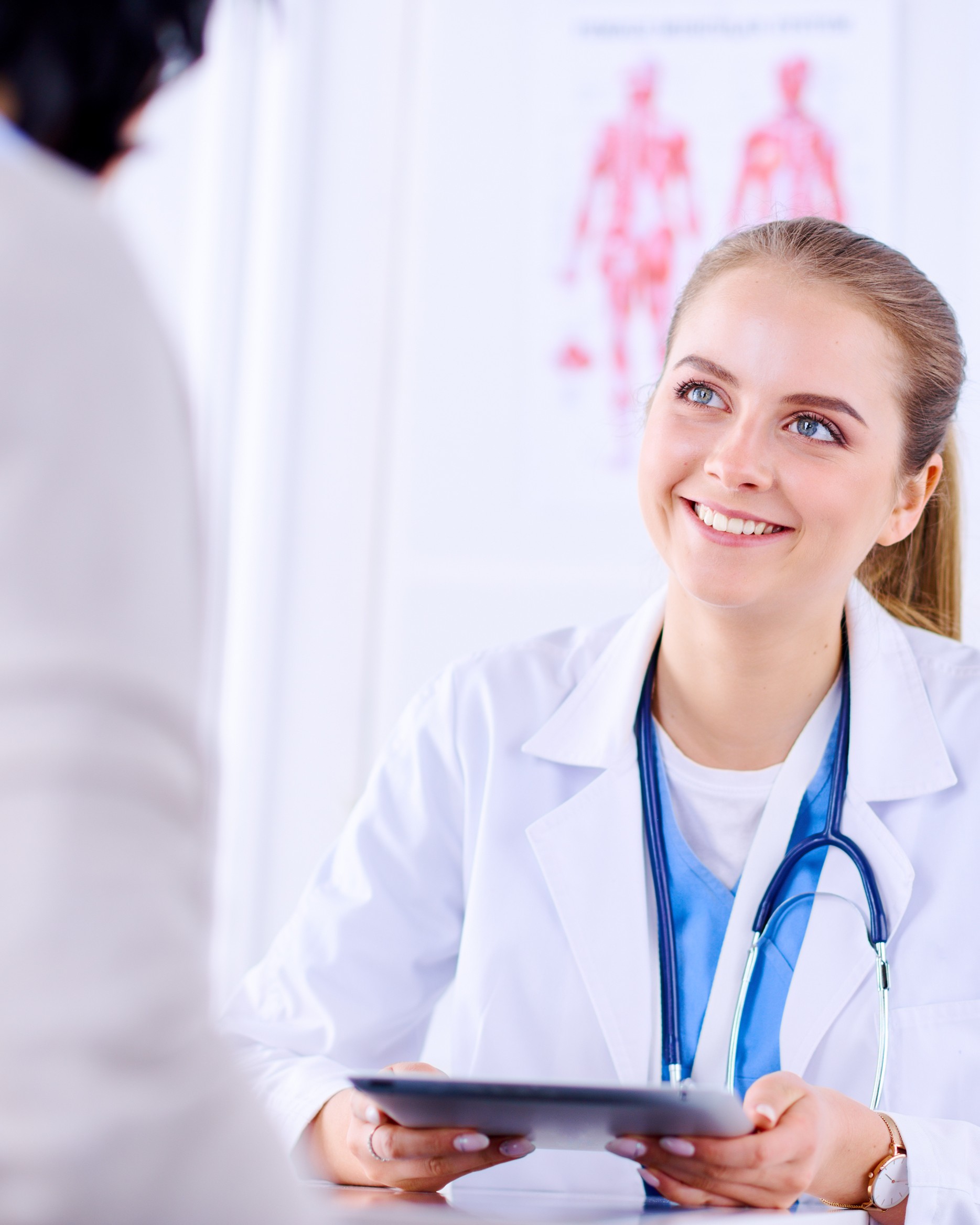 HPV Info & Testing A woman talking to a medical professional about HPV information