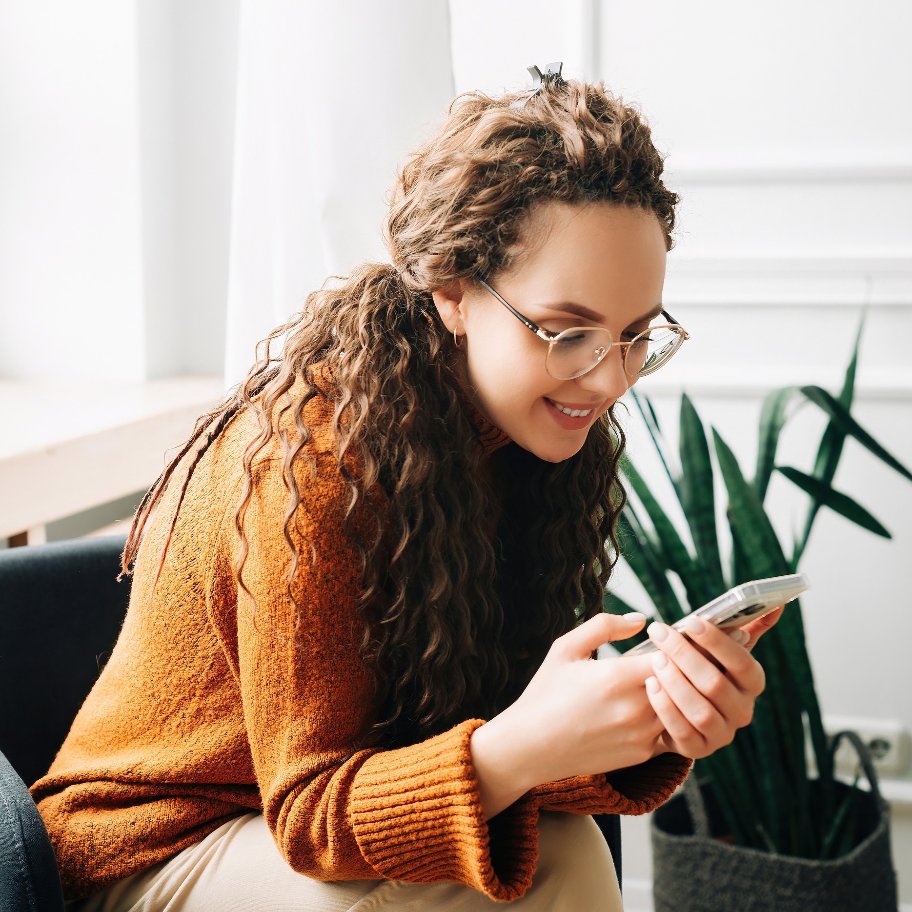 bigstock-Happy-Woman-Browsing-Modern-Ap-475604925