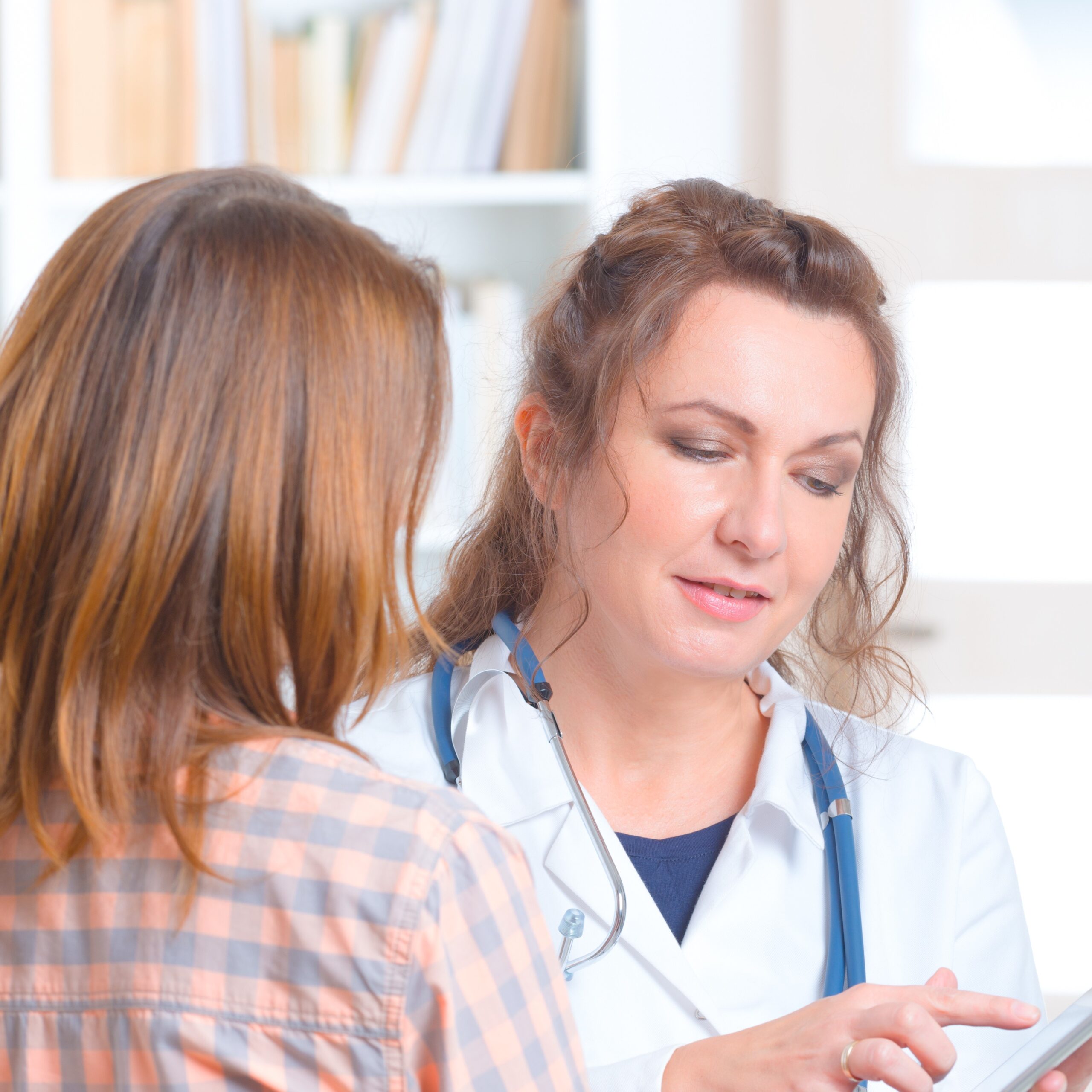 HIV Info A woman talking to a medical professional about HIV information