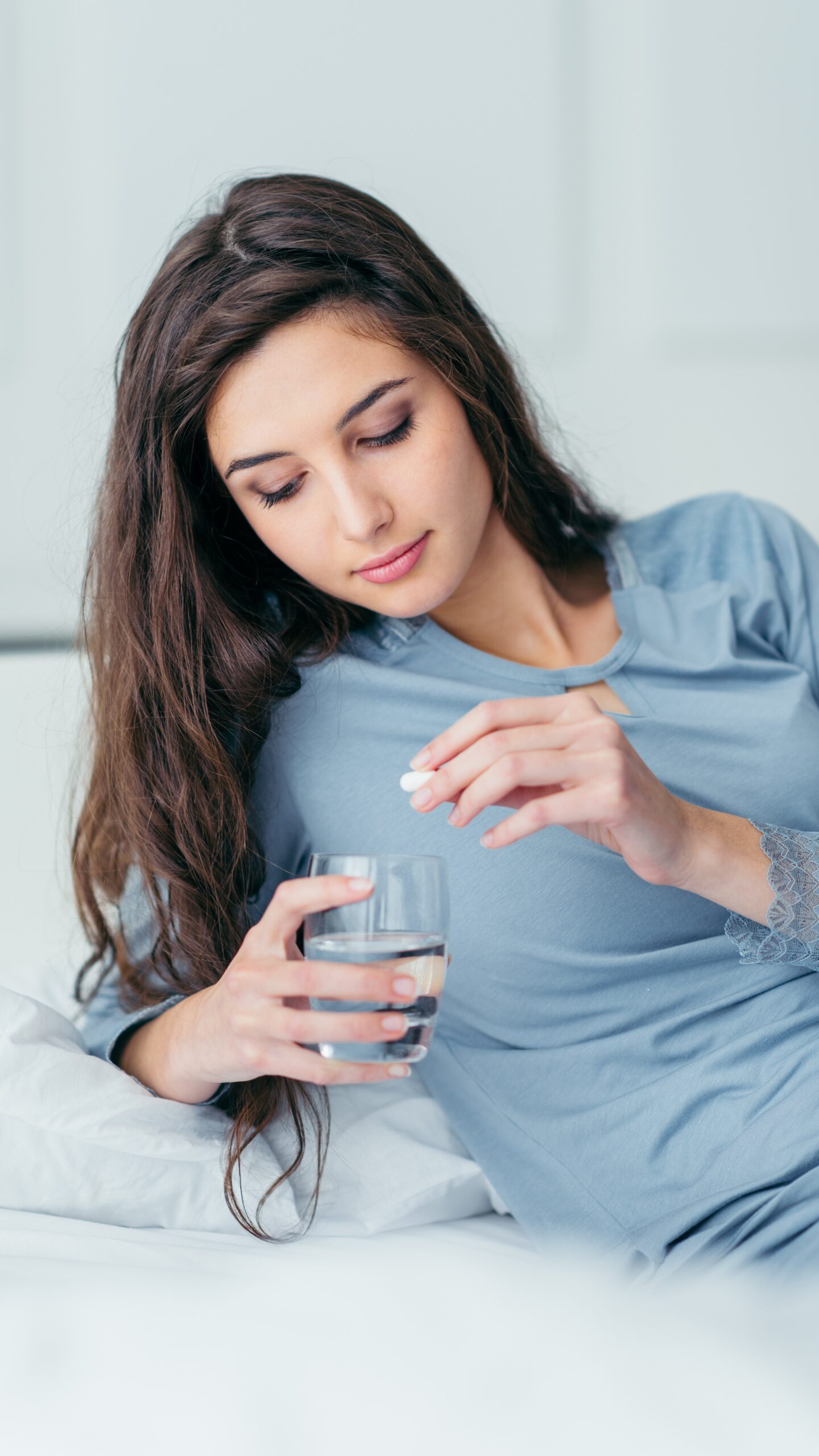 Woman Taking A Pill