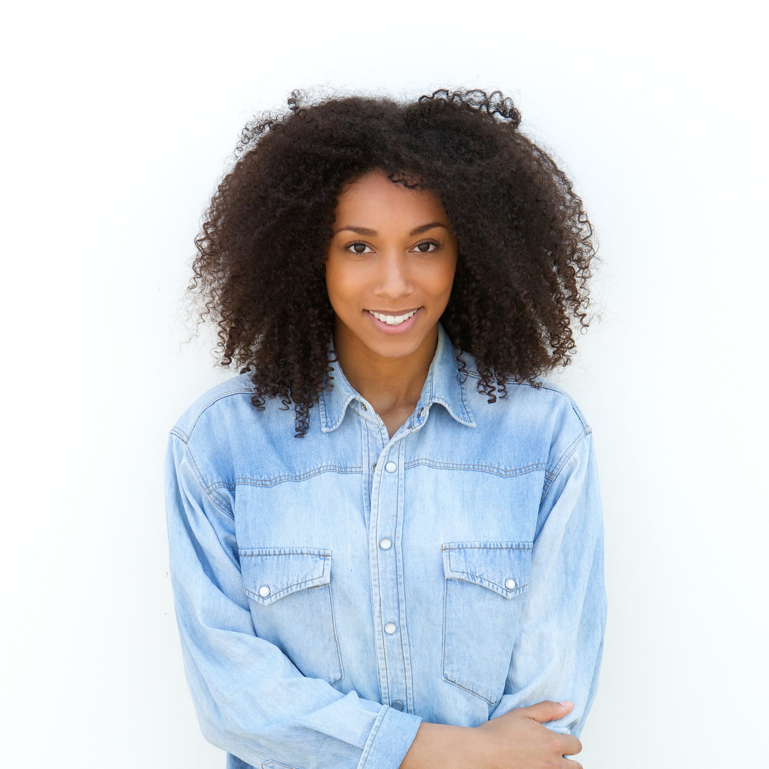 Get Help A woman smiling because she knows she can get Chlamydia testing and treatment at CAPS pregnancy center in San Diego, California