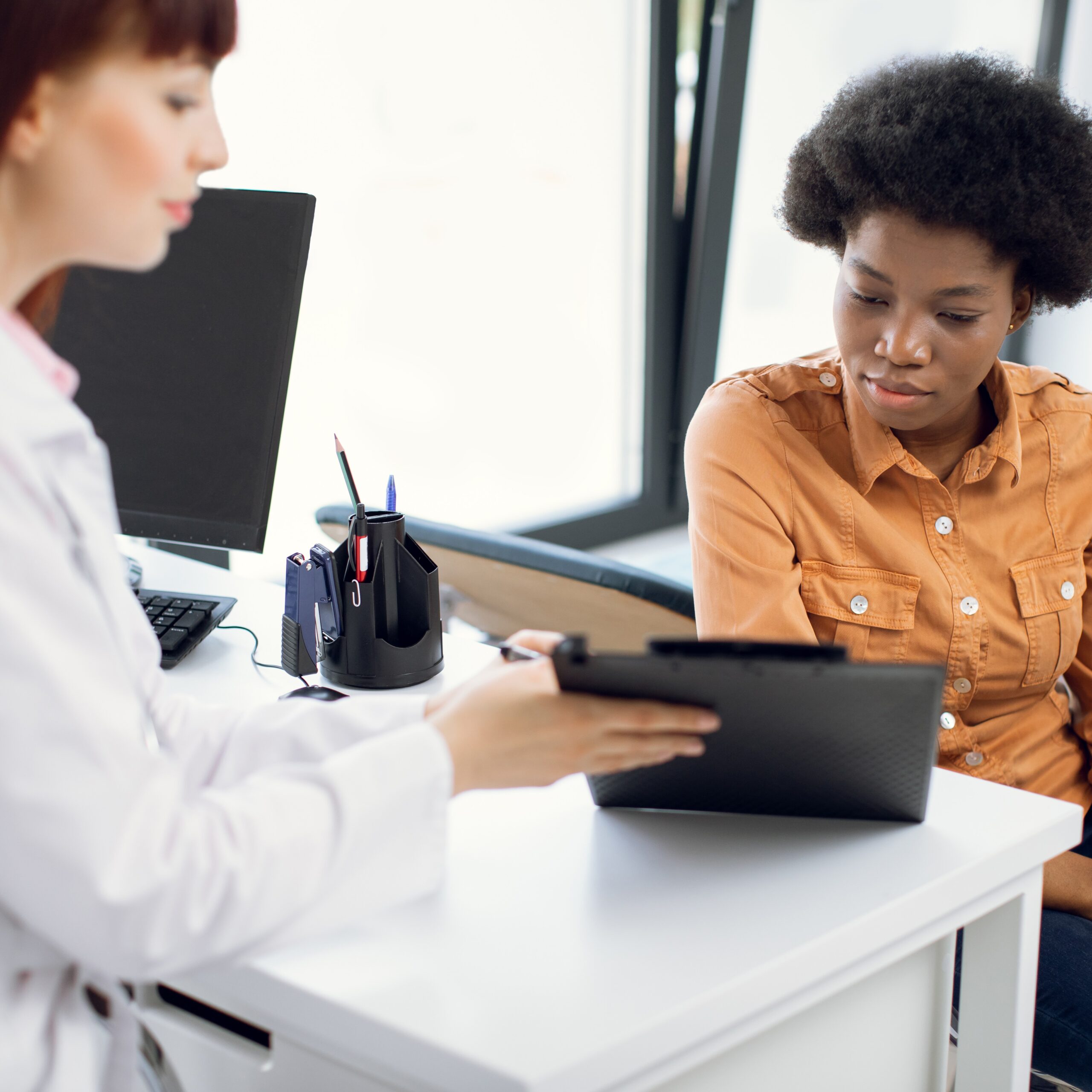 Affordable STI/STD Testing and Treatment A woman learning she can get low to no cost STI/STD testing and treatment in San Diego, California