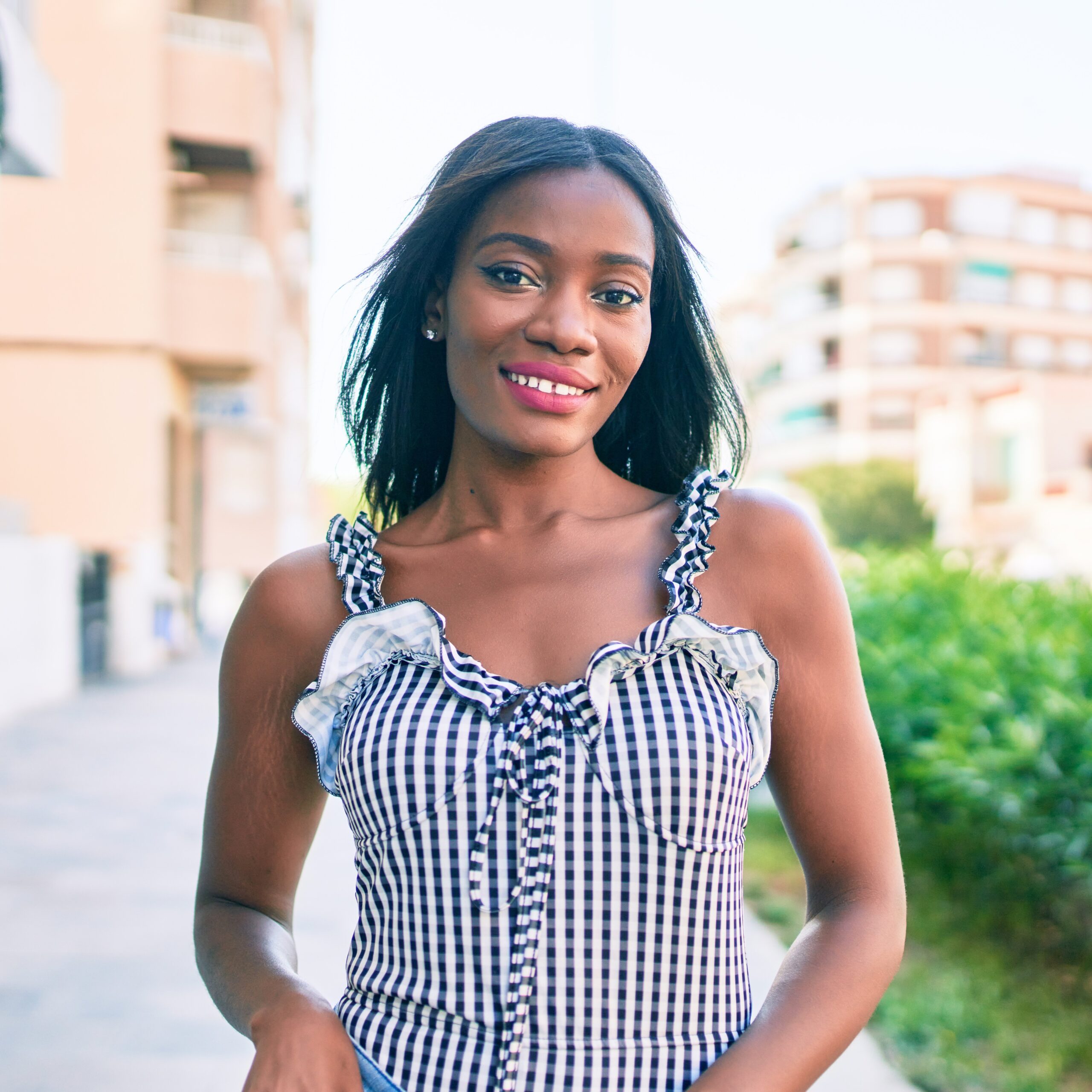 Young african american woman smiling happy walking at street of city
