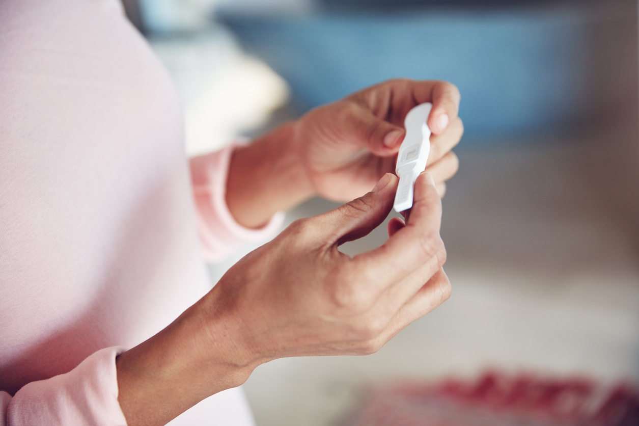 Woman's hands with a pregnancy test in her hands