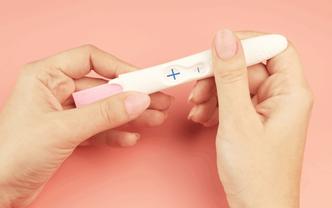woman looking at pregnancy test