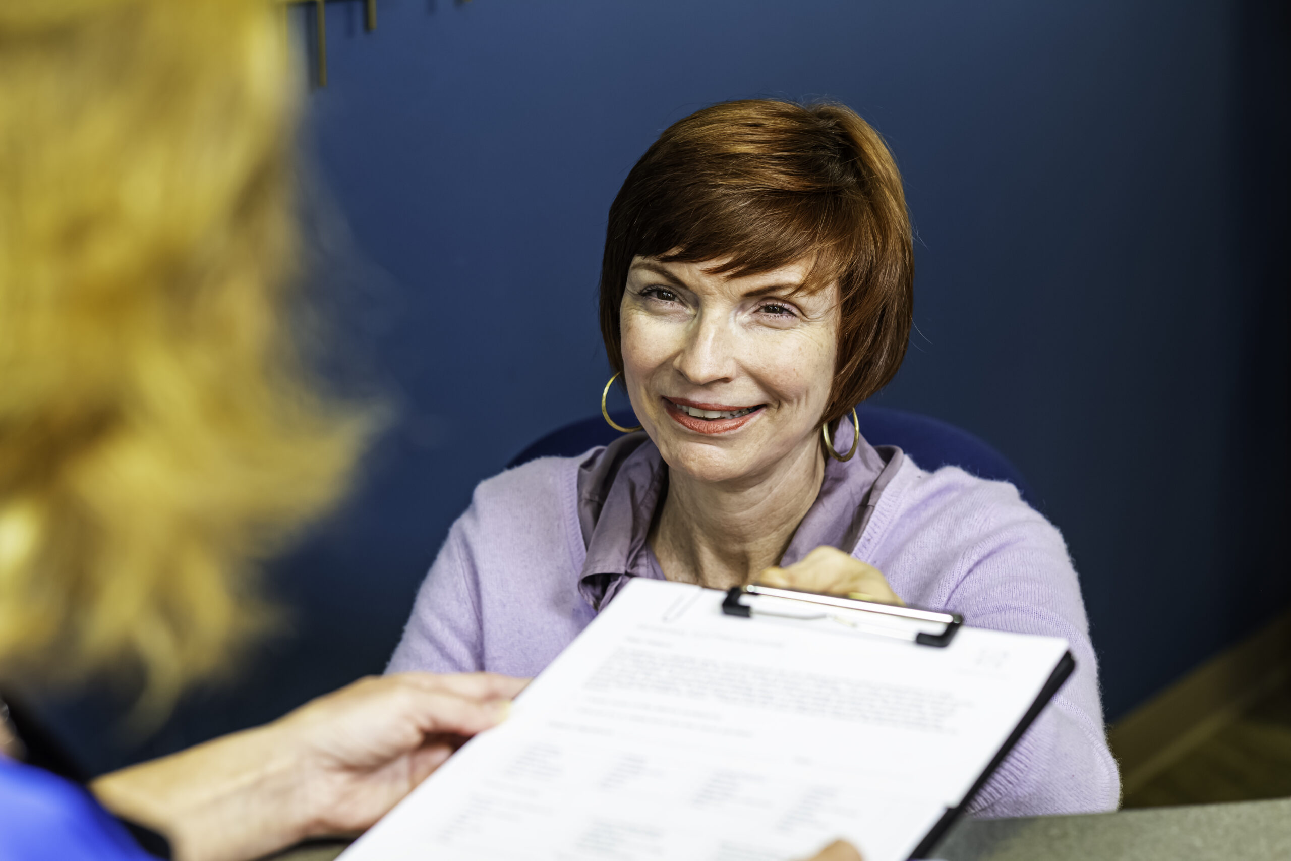 Woman holding a free pregnancy test