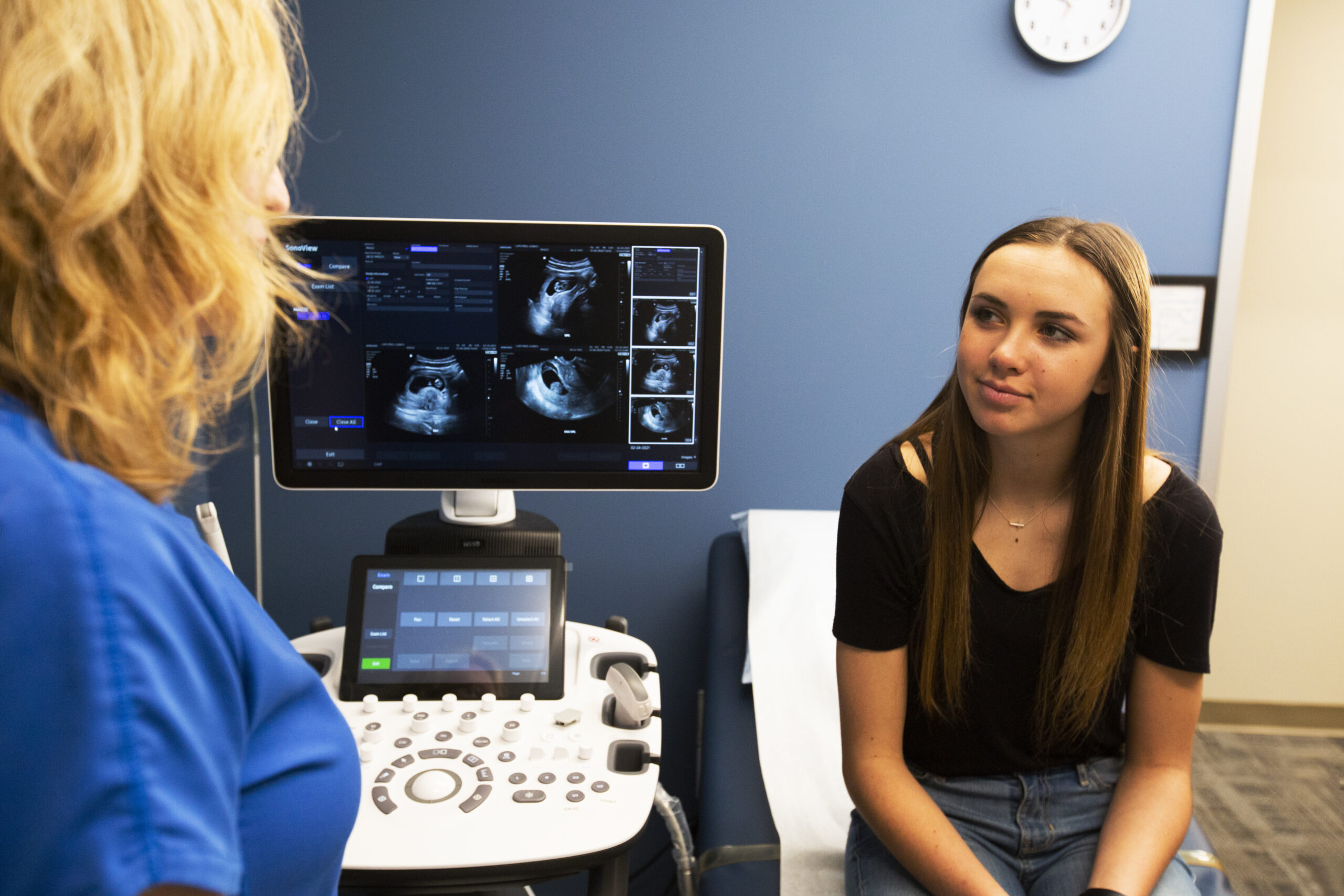 A woman scheduling her free ultrasound at CAPS